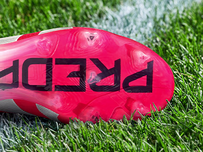 An outsole of an adidas football boot made to be played on firm ground