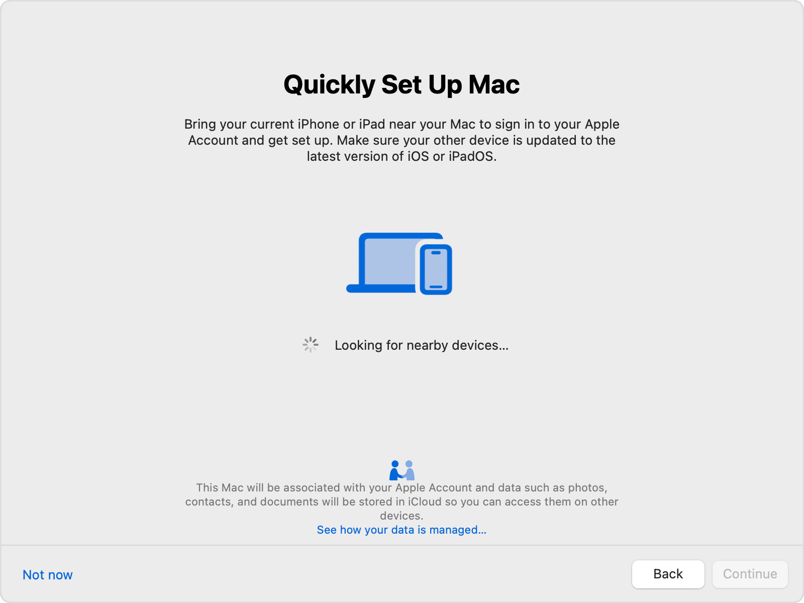 Mac setup assistant window while looking for a nearby iPhone or iPad.
